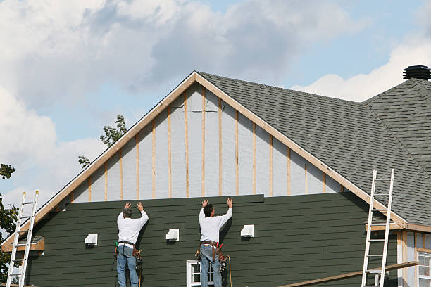 Professional Storm Damage Siding Repair technician working in Hyndman, PA